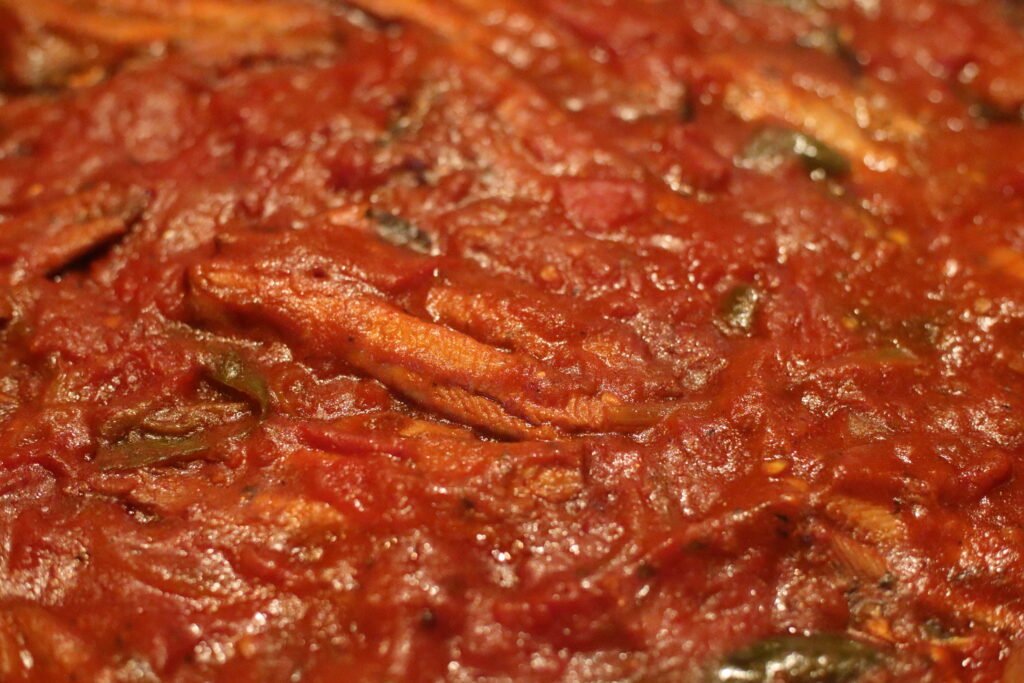 Carefully add the pilchards on top of the chutney.