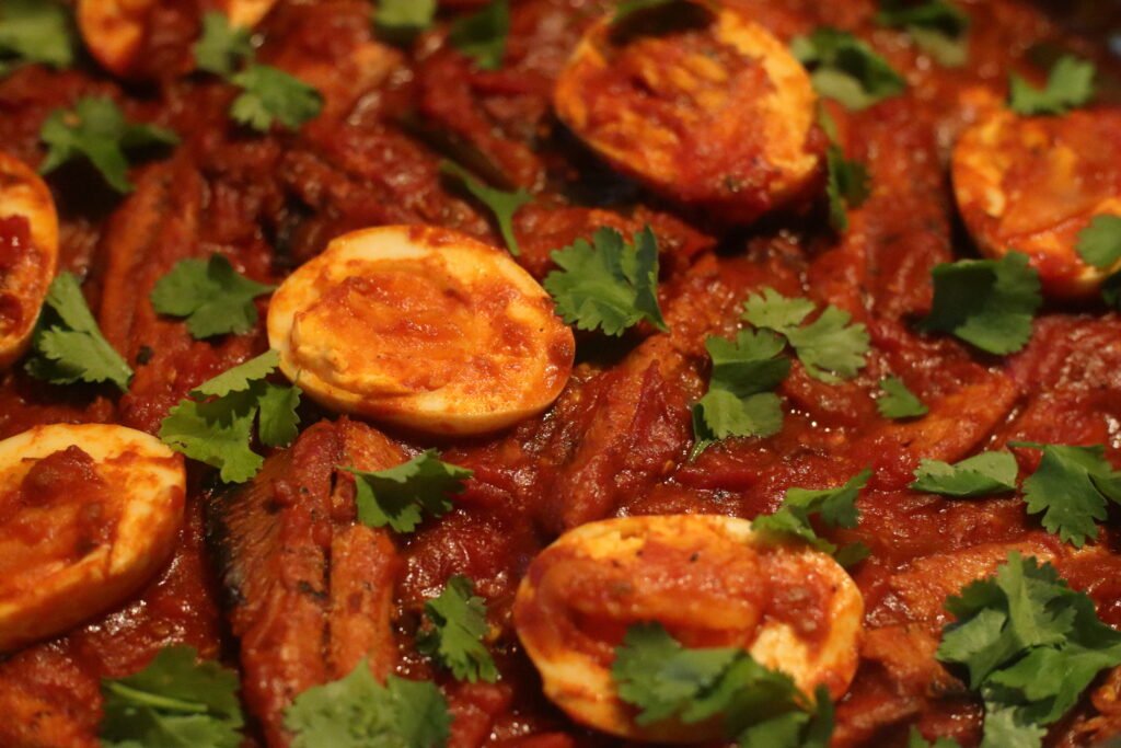 Garnish tinfish chutney with fresh dhania.