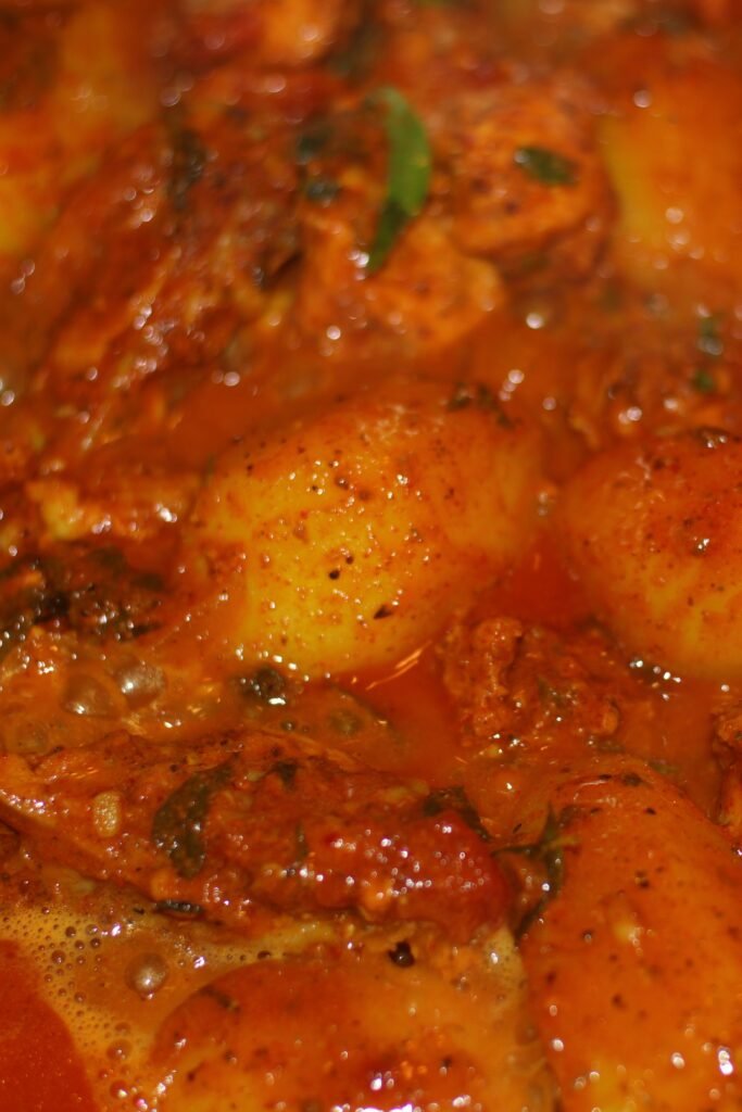 Chicken masala cooking on stove top