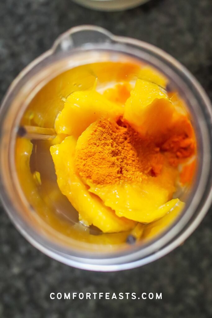 Mango and turmeric in the blender to make chia pudding