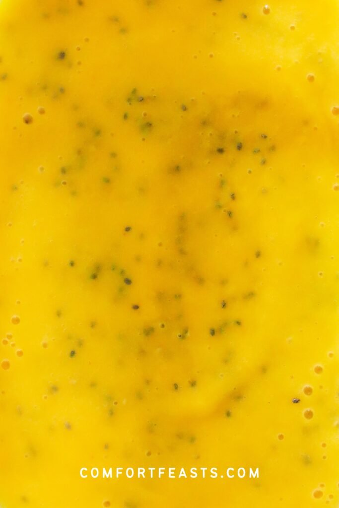 Stirred chia seeds into mango mixture