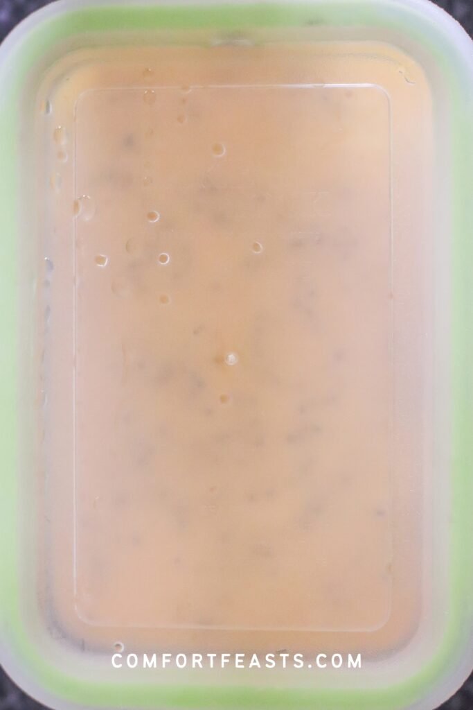 Covered container with thickened chia pudding after refrigerating