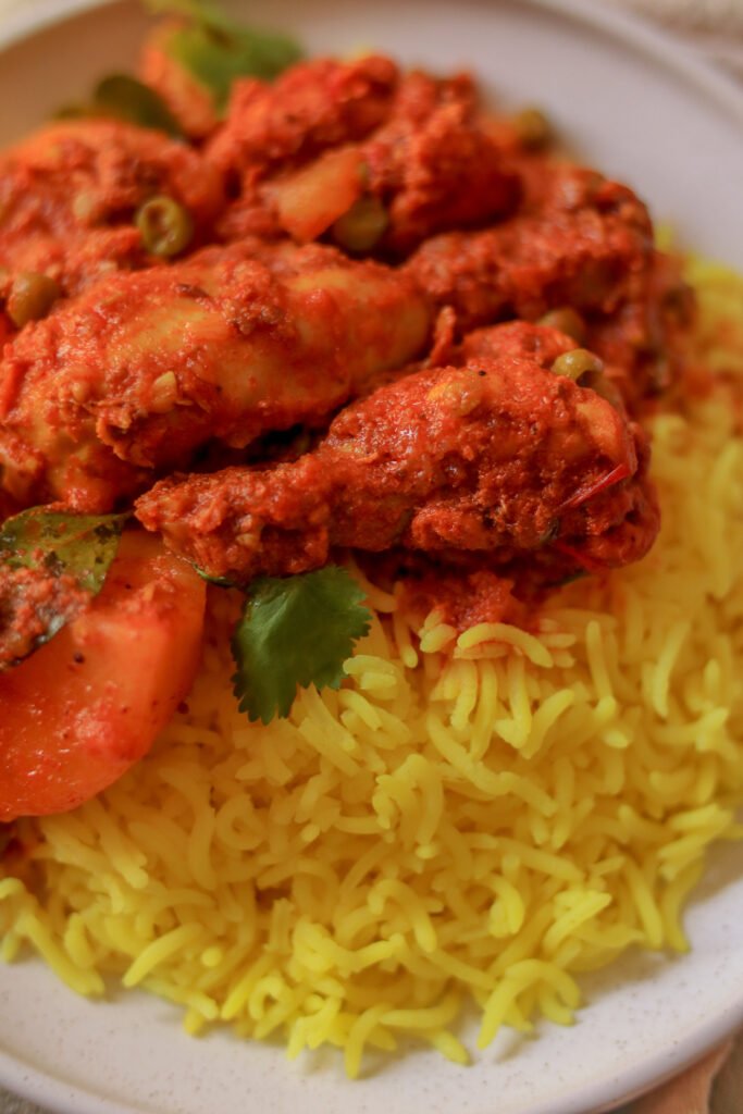 Durban chicken curry served with yellow rice
