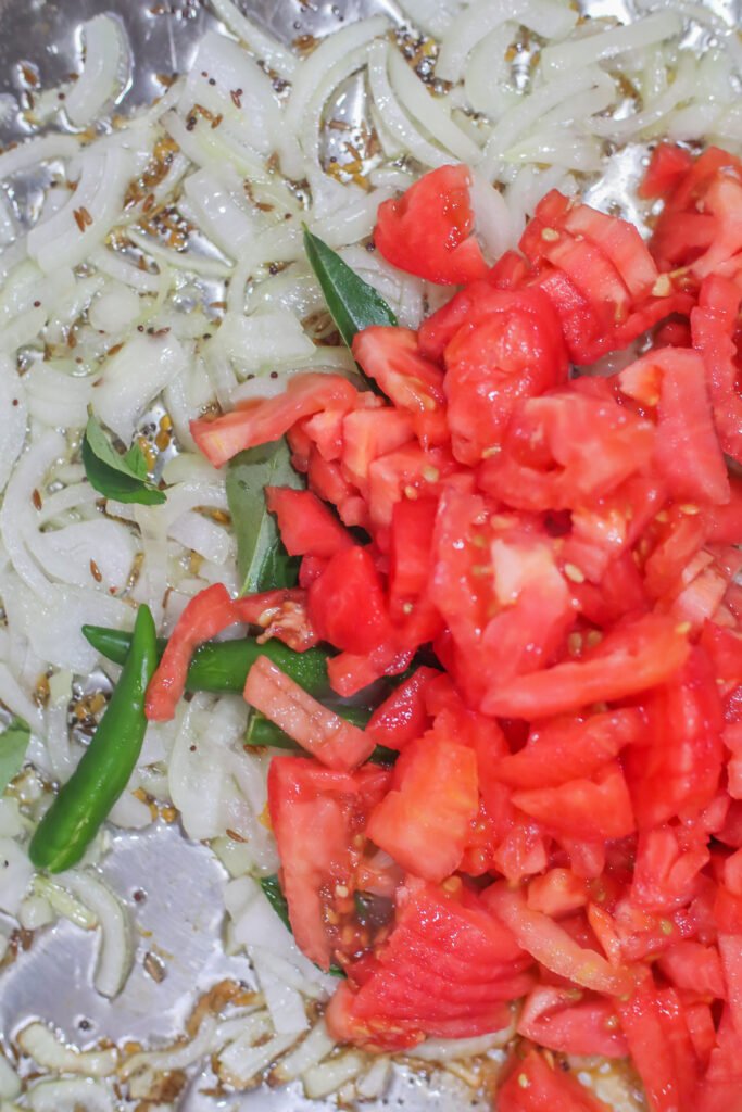 curry leaves chillies and tomatoes added to onions for durban crab curry recipe