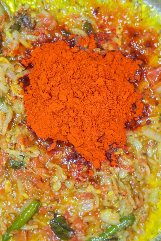 mixed akashmiri chilli powder and turmeric added to curry base for durban crab curry