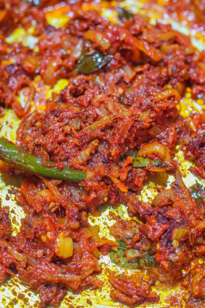 mixed akashmiri chilli powder and turmeric added to curry base for durban crab curry