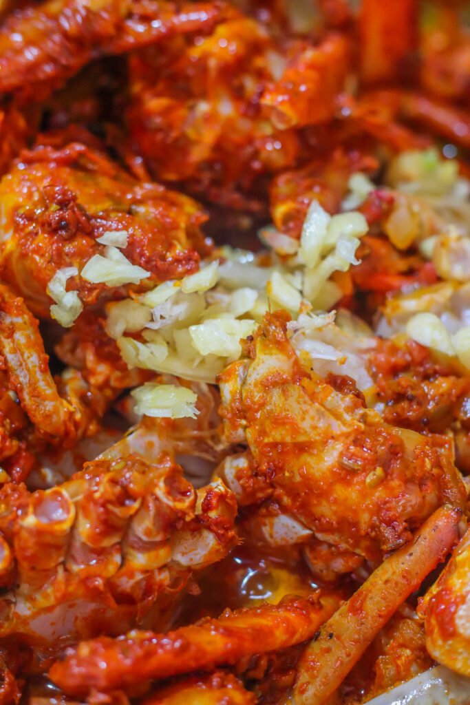 minced garlic fresh crab pieces coated in spice mixture for authentic durban crab curry recipe