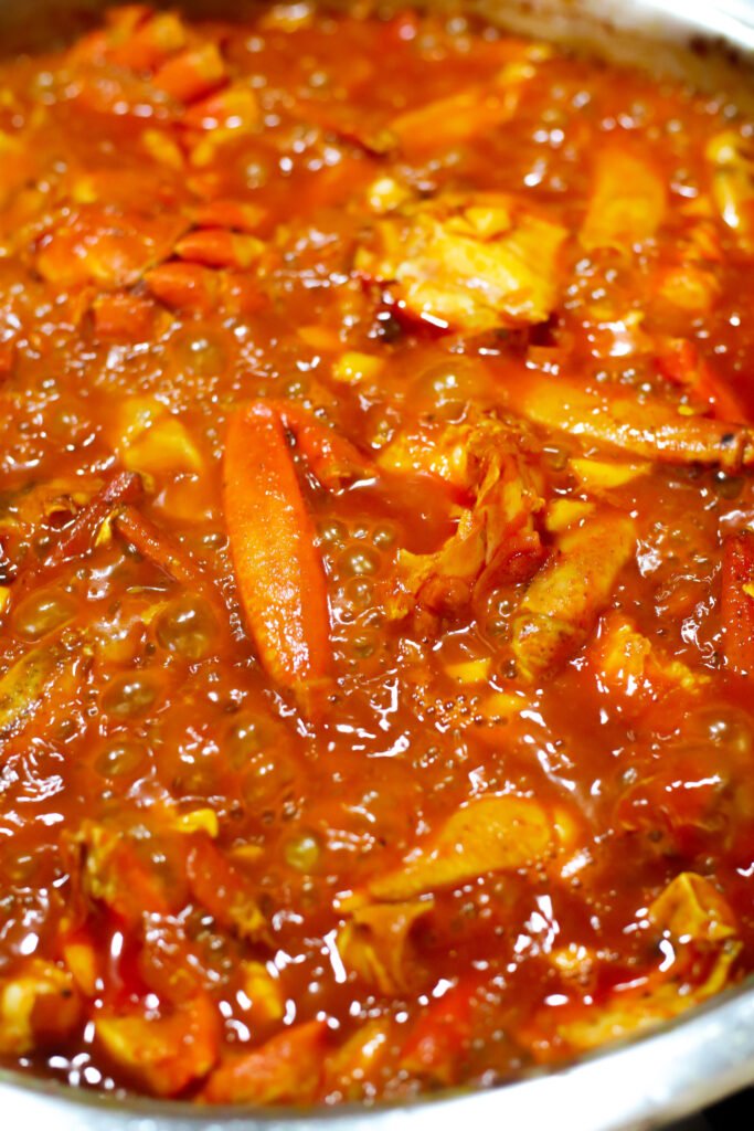 durban crab curry simmering in pot 