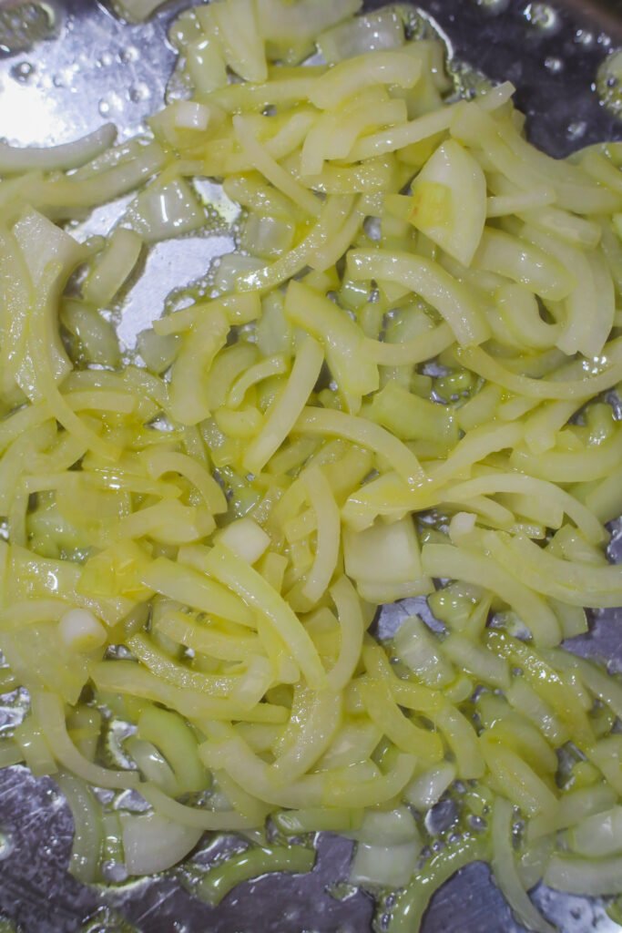 butter and onions cooking in pan
