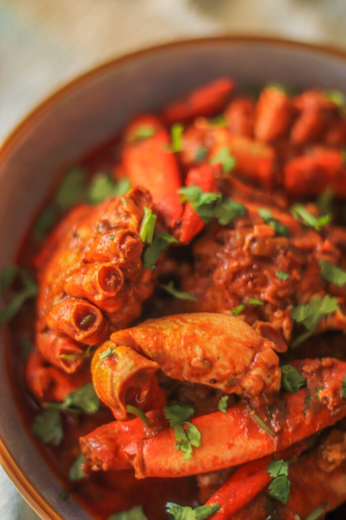 durban crab curry garnished with fresh coriander 