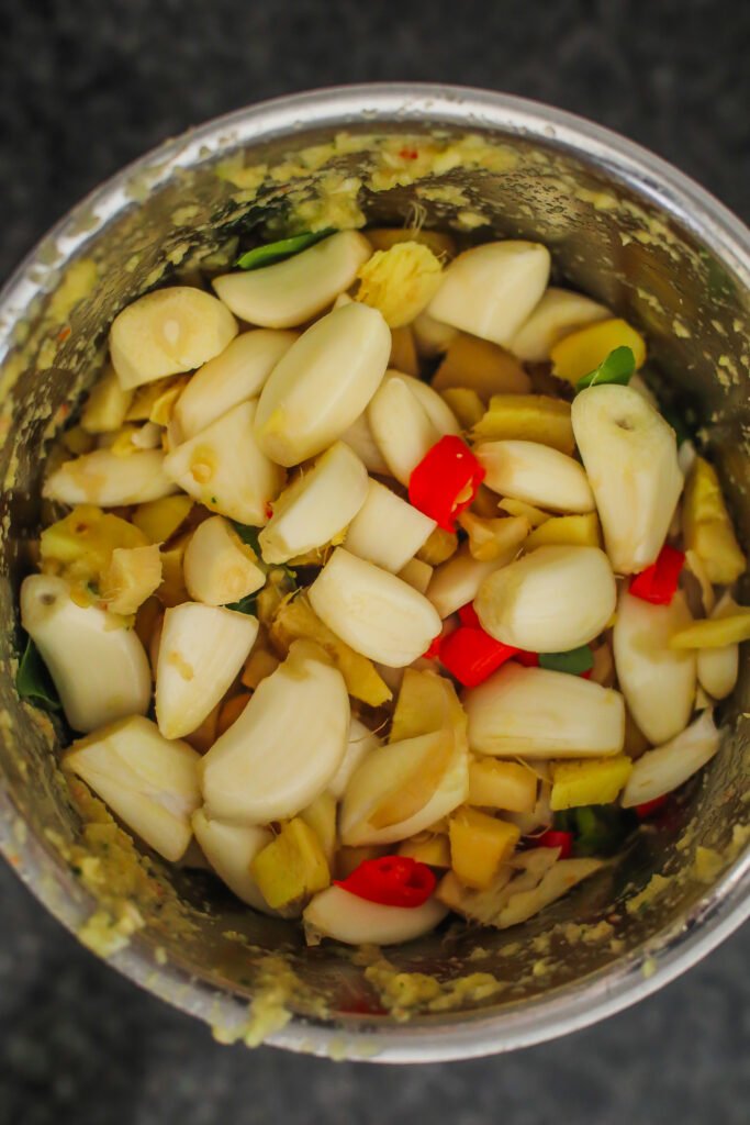 ginger, garlic, chillies and curry leaves placed in a food processor