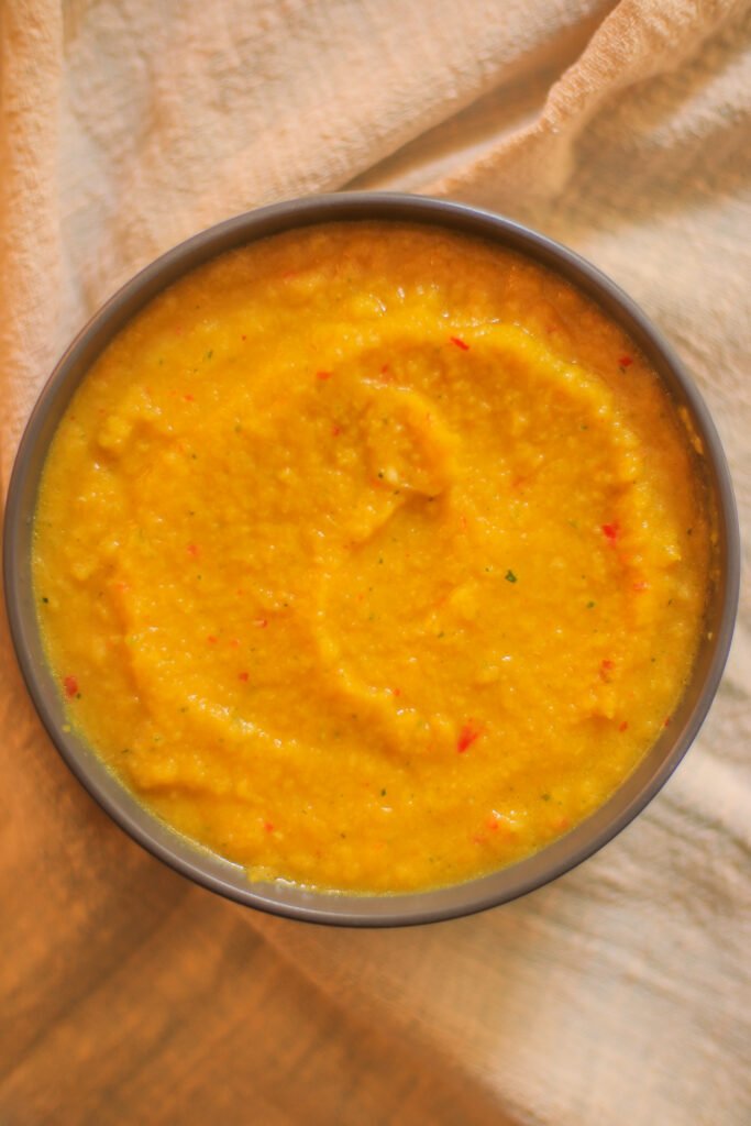 vegetable oil and turmeric stirred into freshly blended ginger and garlic paste
