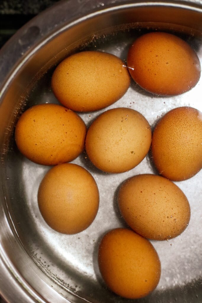 boiling eggs in a pot with bicarbonate of soda